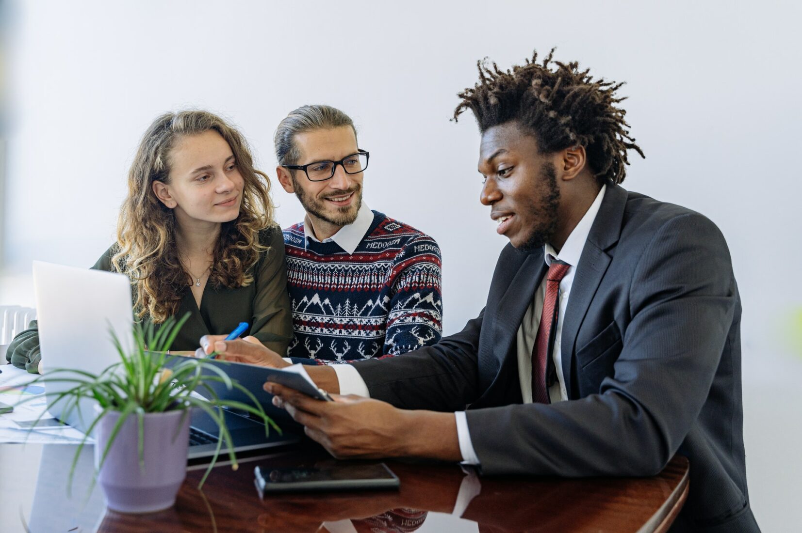 Realtor having a discussion with his clients