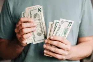 counting money to pay REALTOR commission costs