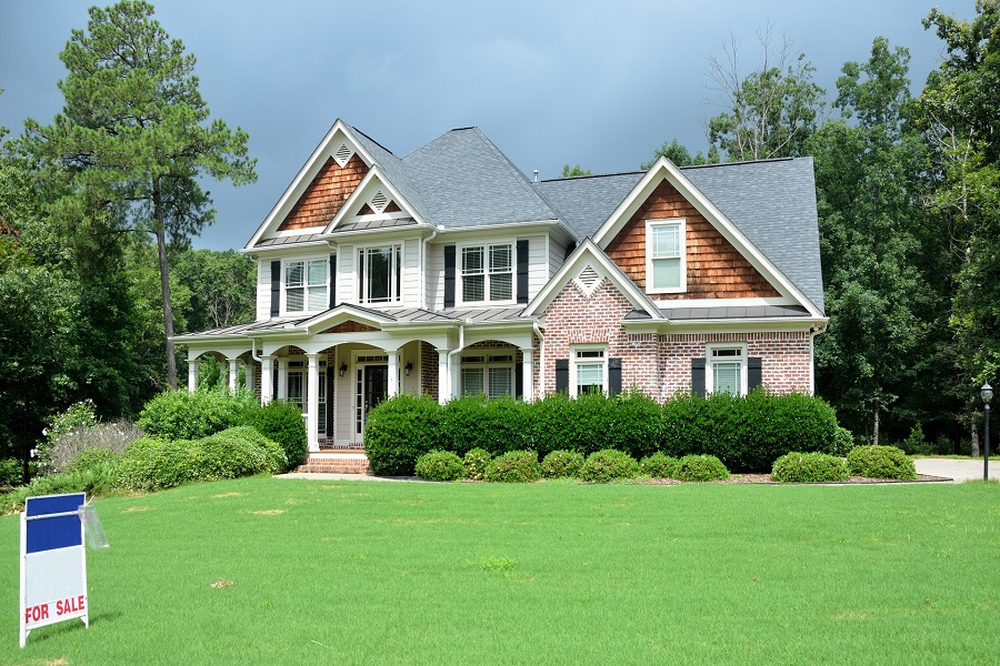 A house for sale with a spacious lawn