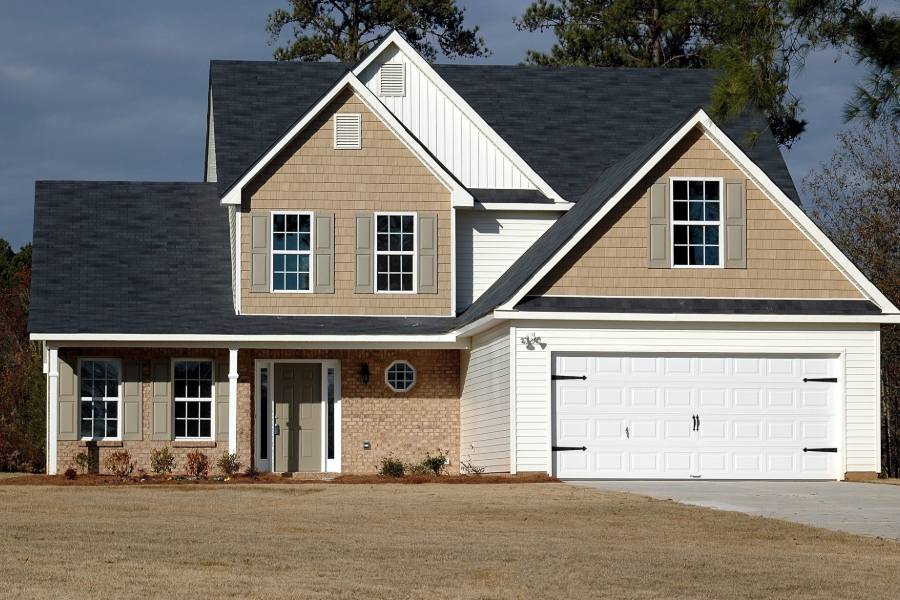 A brown and white two-storey house