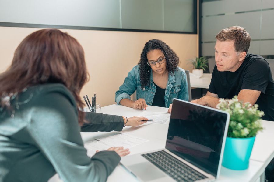 REALTOR negotiating with her clients