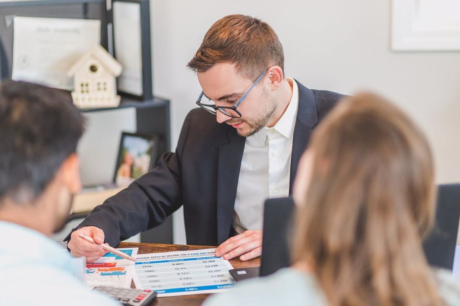 Realtor explaining the required fees to clients