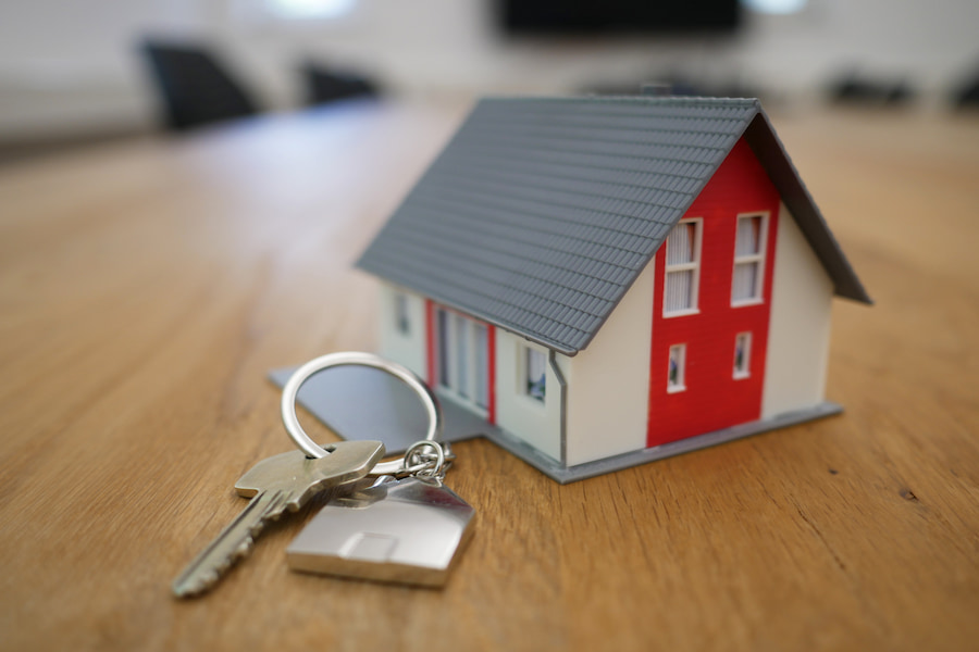 An image of a miniature house and keys