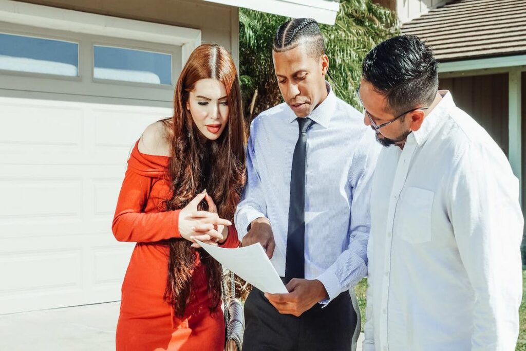 Real estate agent explaining a document to a couple