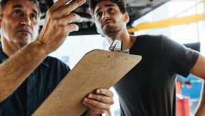 a homeowner consulting with home inspector inside a house.