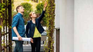 an appraiser inspecting property with homeowner