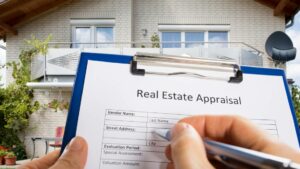 an home appraiser filling up real estate appraisal form